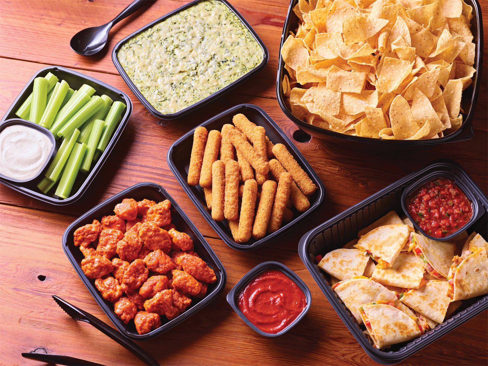 Applebee's appetizer trays — wings, mozzarella sticks, dips, and quesadillas