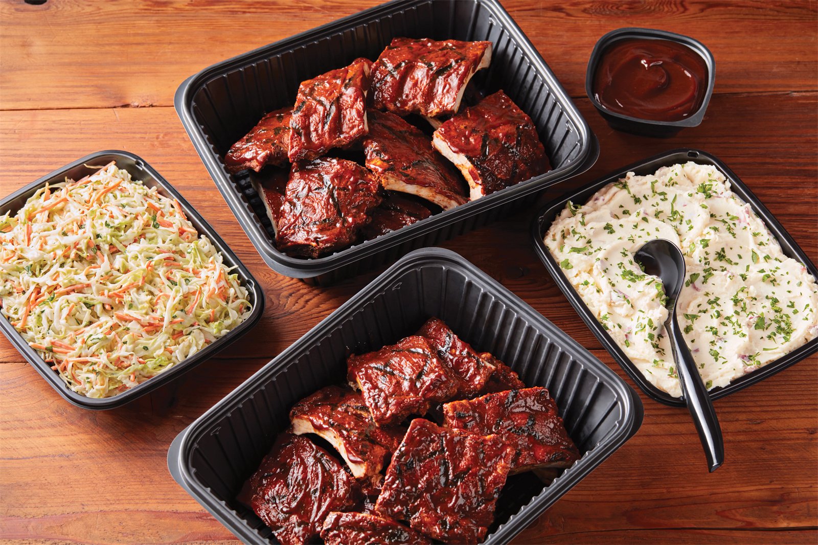 Applebee's ribs, coleslaw, and mashed potatoes catering trays